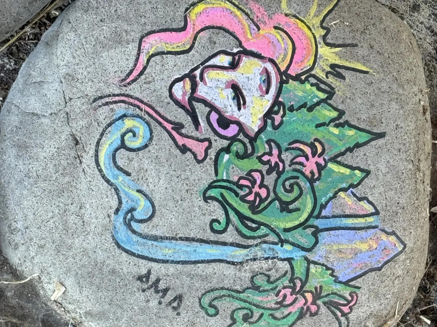 Colorfully painted rock found along a Eugene bike path